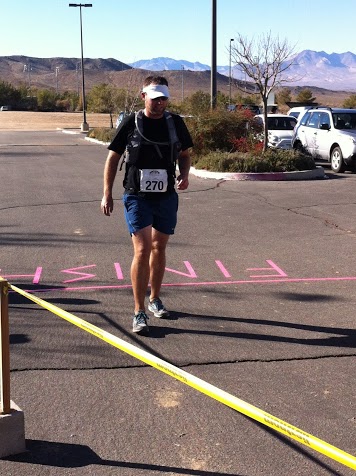 Crossing the finish in 6:24
